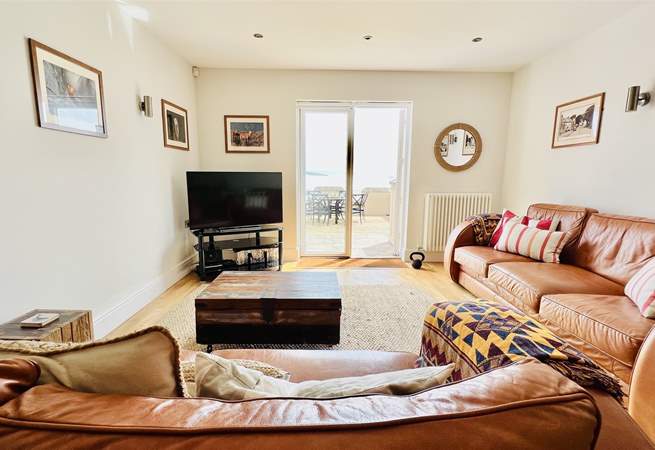 Relax in the open plan living space after a busy beach day. 