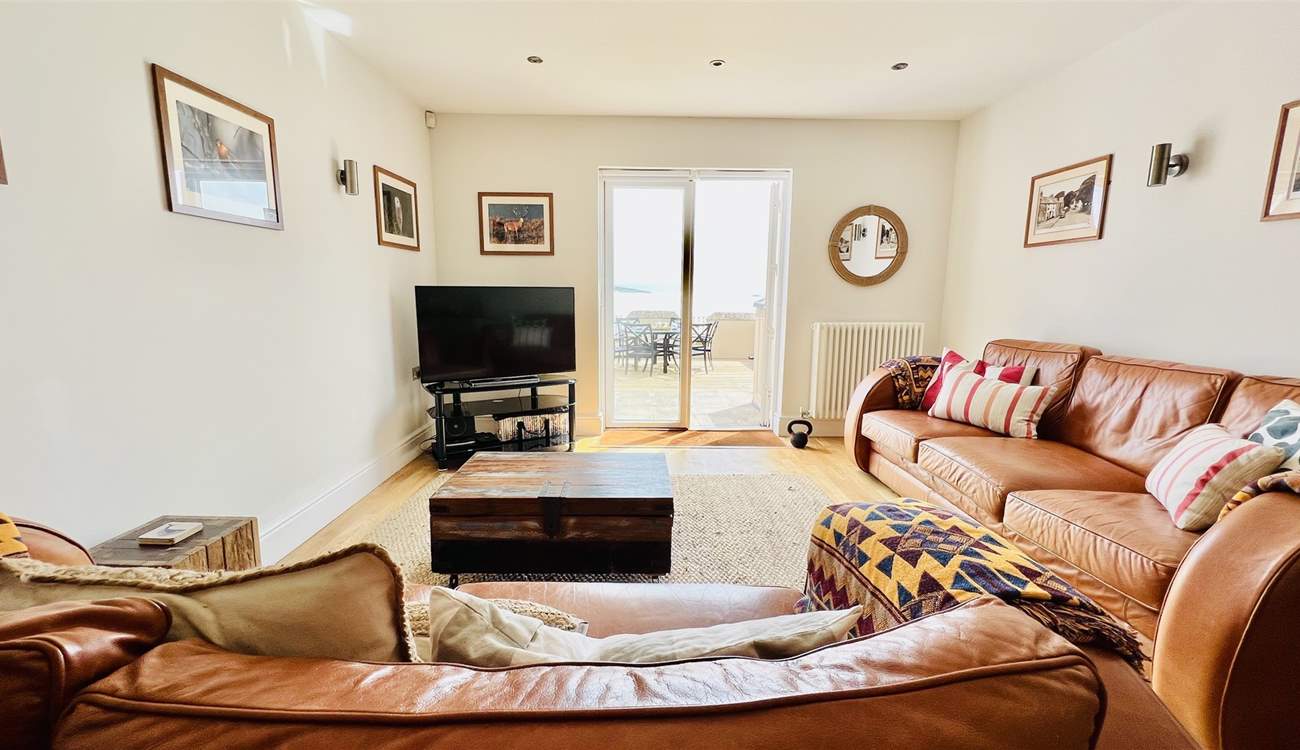 Relax in the open plan living space after a busy beach day. 