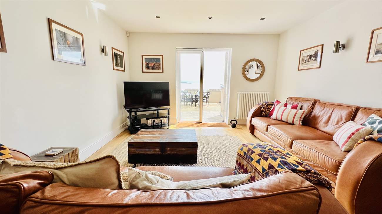 Relax in the open plan living space after a busy beach day.