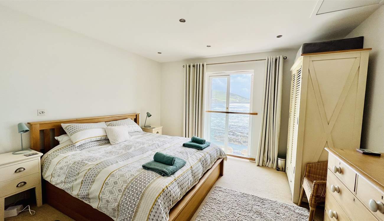 The principal bedroom has magical views and a super-king size bed, plus an en suite shower-room. 