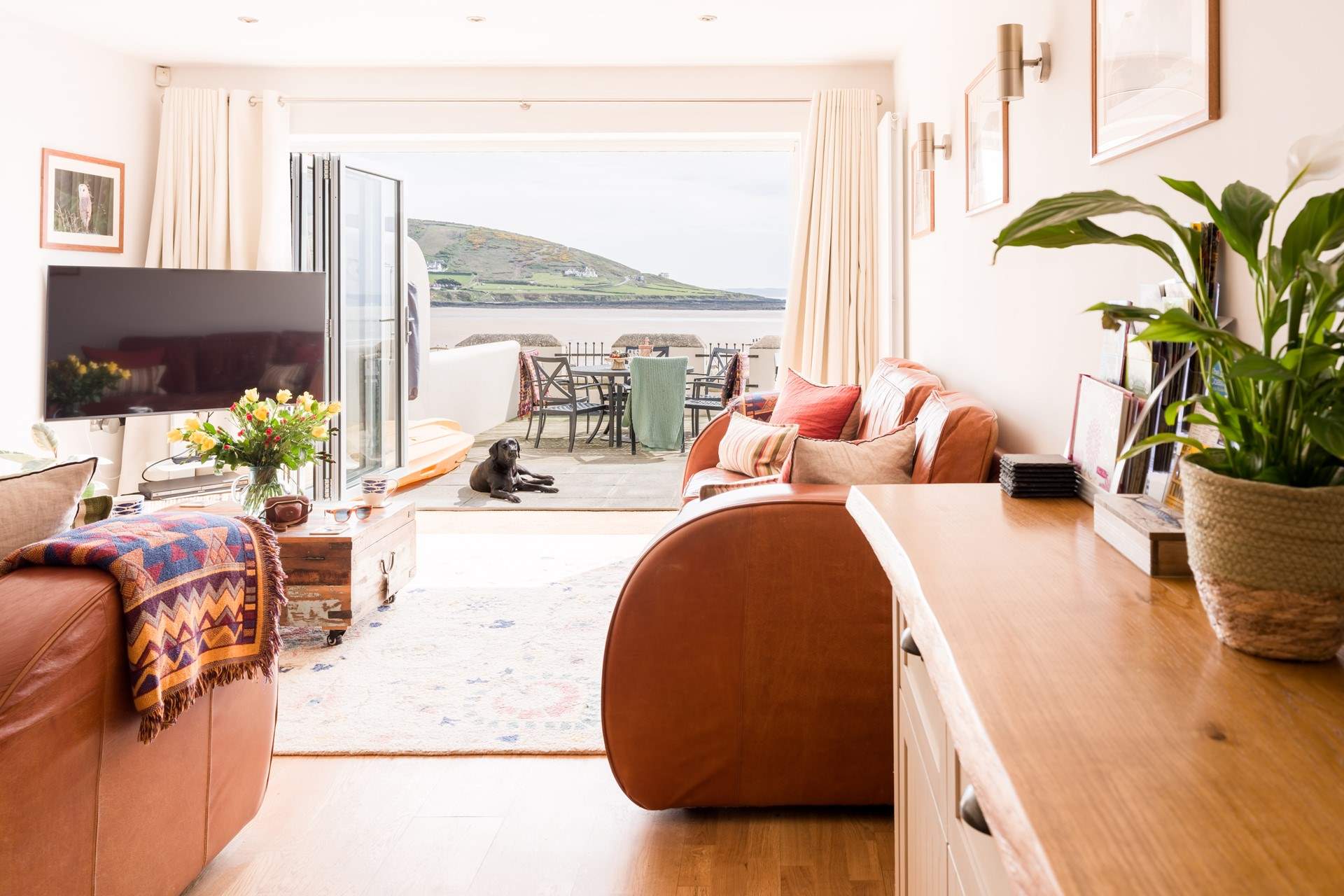 Relax in the open plan living space after a busy beach day. 
