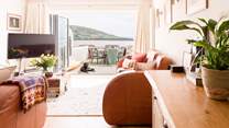 Relax in the open plan living space after a busy beach day. 