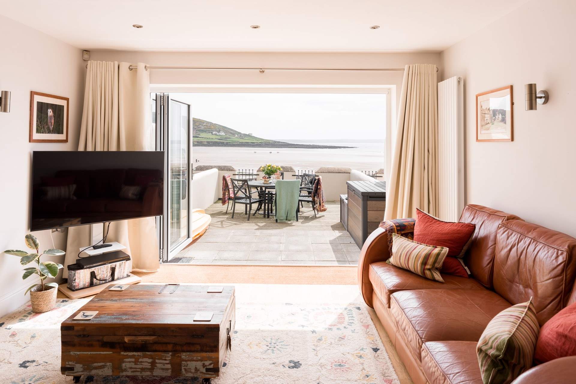 After a busy day, snuggle up on the sofas and watch a movie.