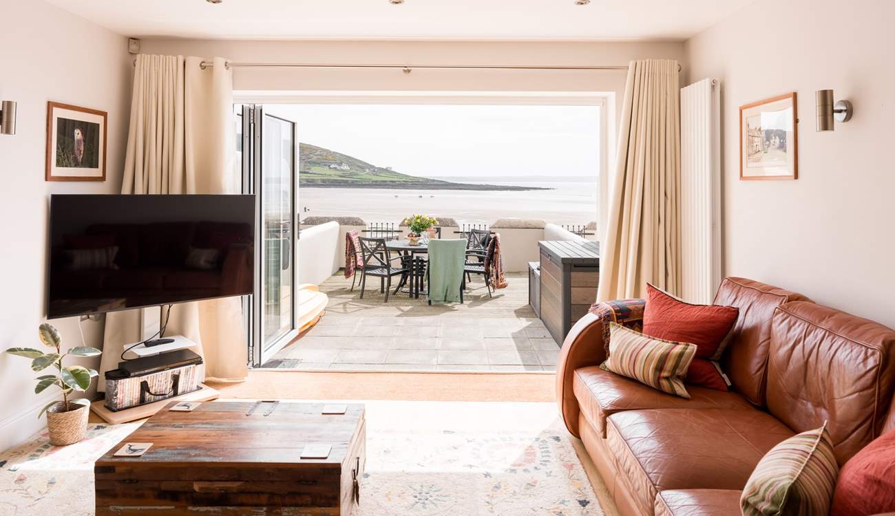 After a busy day, snuggle up on the sofas and watch a movie.