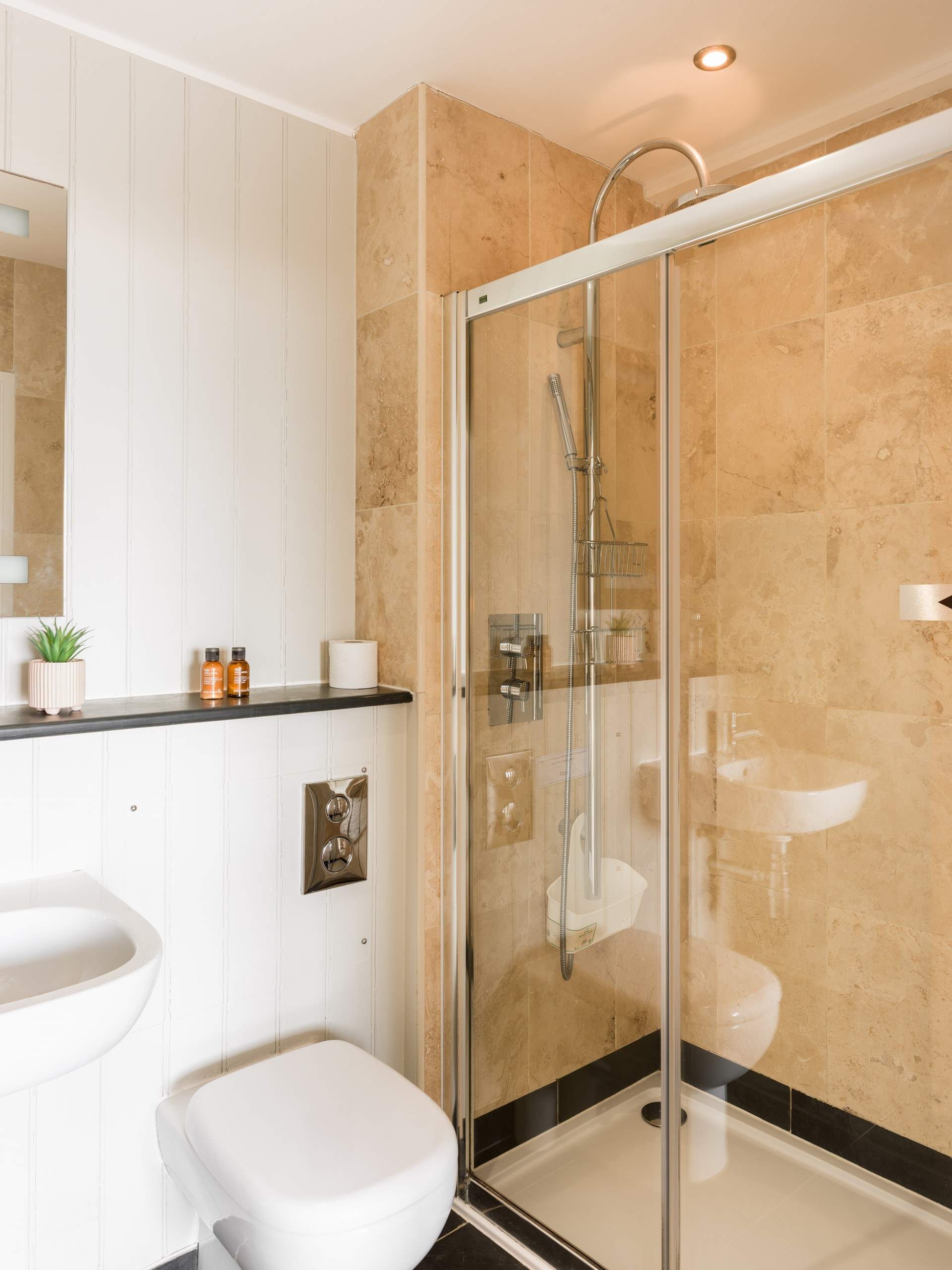 Bedroom 2 has its own en suite shower-room - perfect for rinsing sandy toes.
