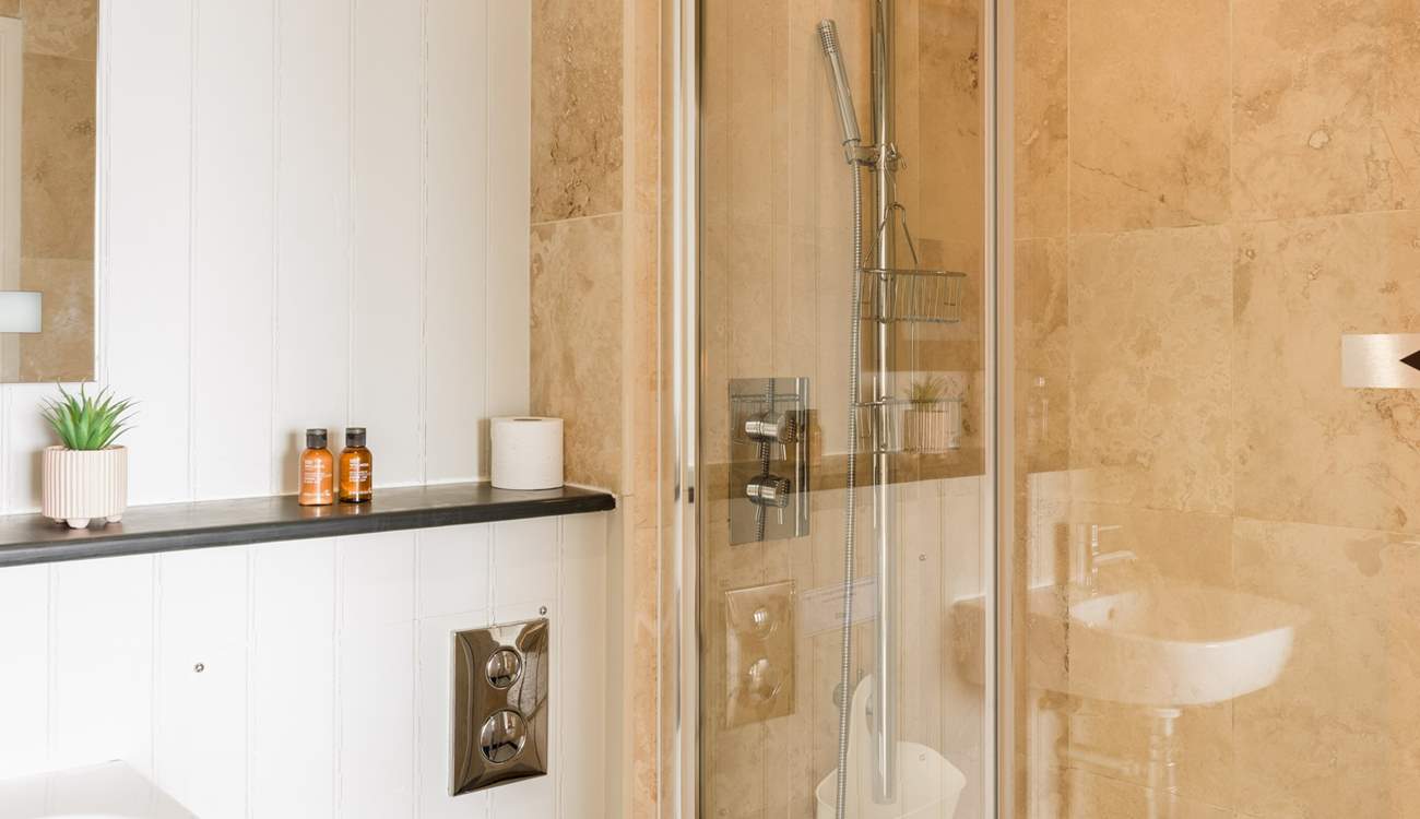 Bedroom 2 has its own en suite shower-room - perfect for rinsing sandy toes.