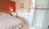 The double bedroom has a shower cubicle and wash-basin.  - Thumbnail Image