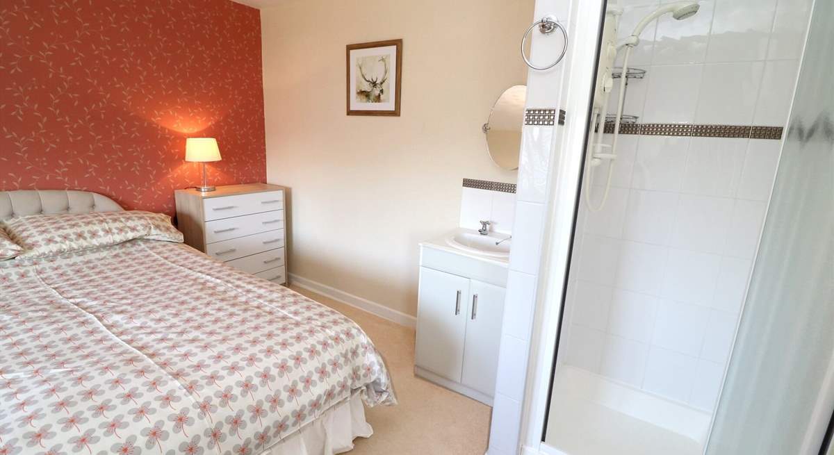 The double bedroom has a shower cubicle and wash-basin. 