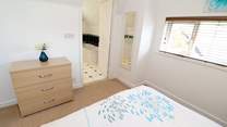 Bedroom 3 on the first floor has a king-size bed and en suite bathroom.