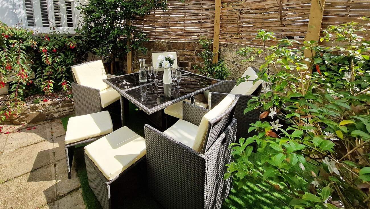 Sit in the secluded garden and enjoy al fresco dining.