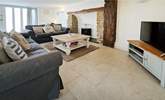 Snuggle up on the cosy sofas and catch a movie on the Smart TV. - Thumbnail Image