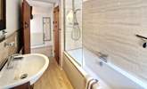 The family bathroom has a bath with shower over.  - Thumbnail Image