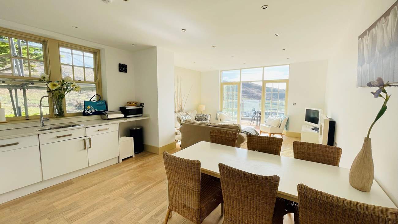 The open plan living space is beautifully furnished.