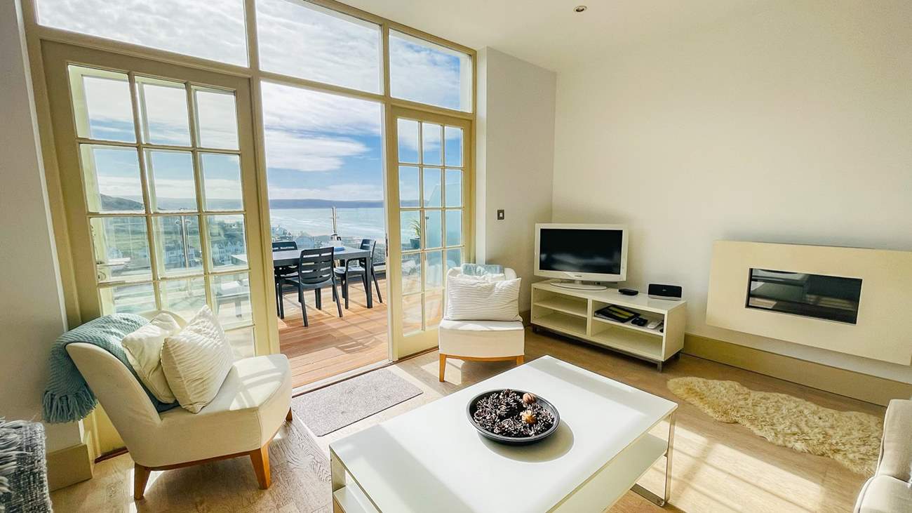 Pastel shades in the living space coordinate beautifully with the sea views.