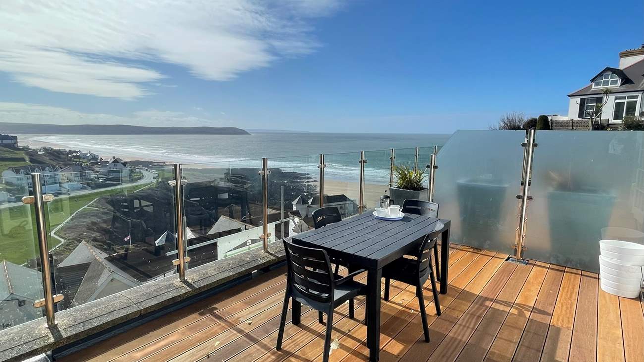 The spacious balcony takes in the views across the bay and countryside.