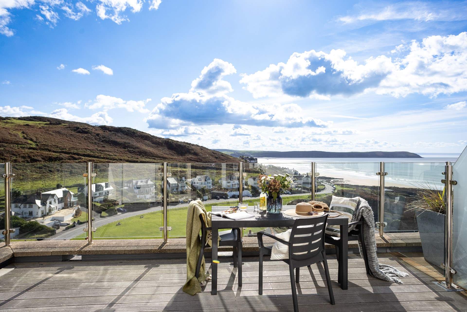 Al fresco dining on the balcony in this rather special holiday home. 
