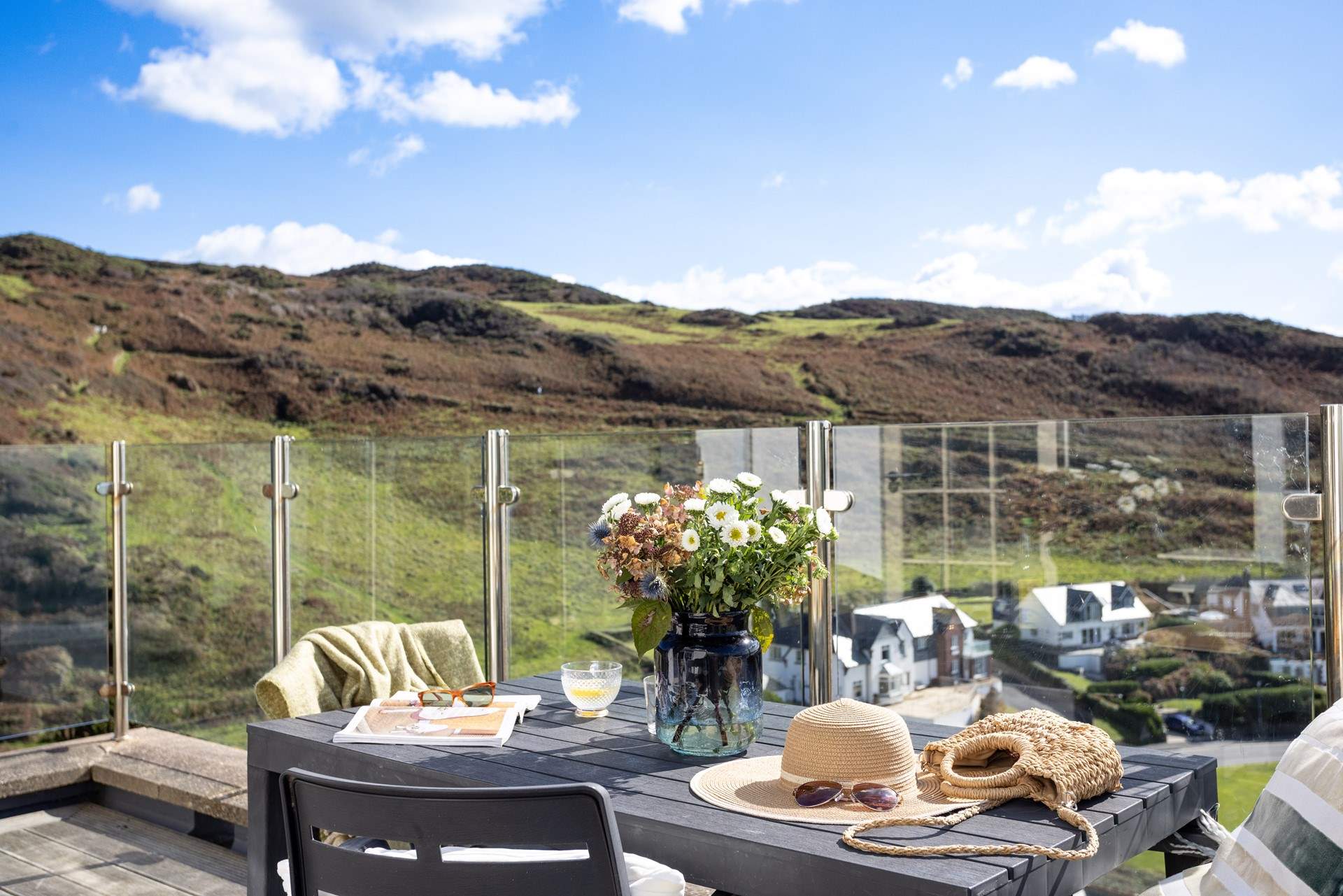 The spacious balcony takes in the views across the bay and countryside. 