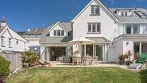 This semi-detached house offers a stunning patio and lawned area. 