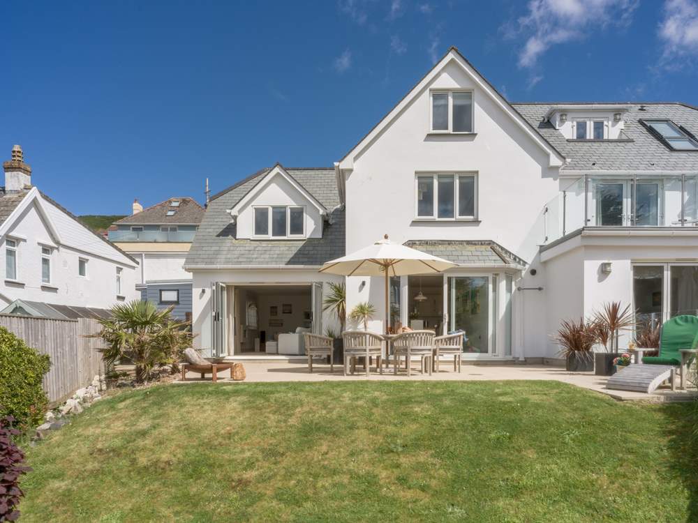 This semi-detached house offers a stunning patio and lawned area.