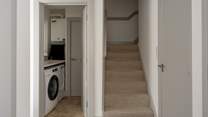 The handy utility-room on the left, the downstairs cloakroom on the right.