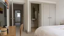 An en suite shower-room benefits this bedroom.