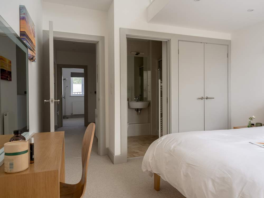 An en suite shower-room benefits this bedroom.