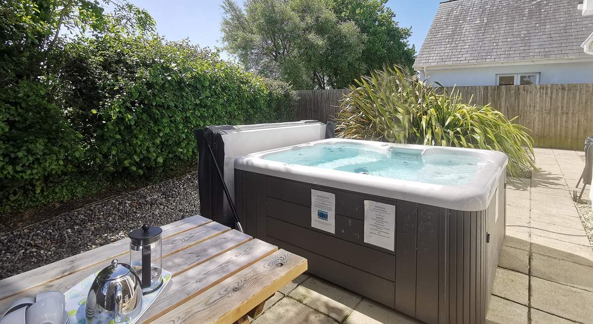 Relax in the hot tub after a busy beach day. Additional charges apply.