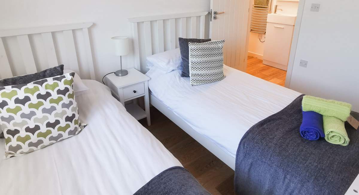 The twin bedroom has the luxury of an en suite shower-room. 