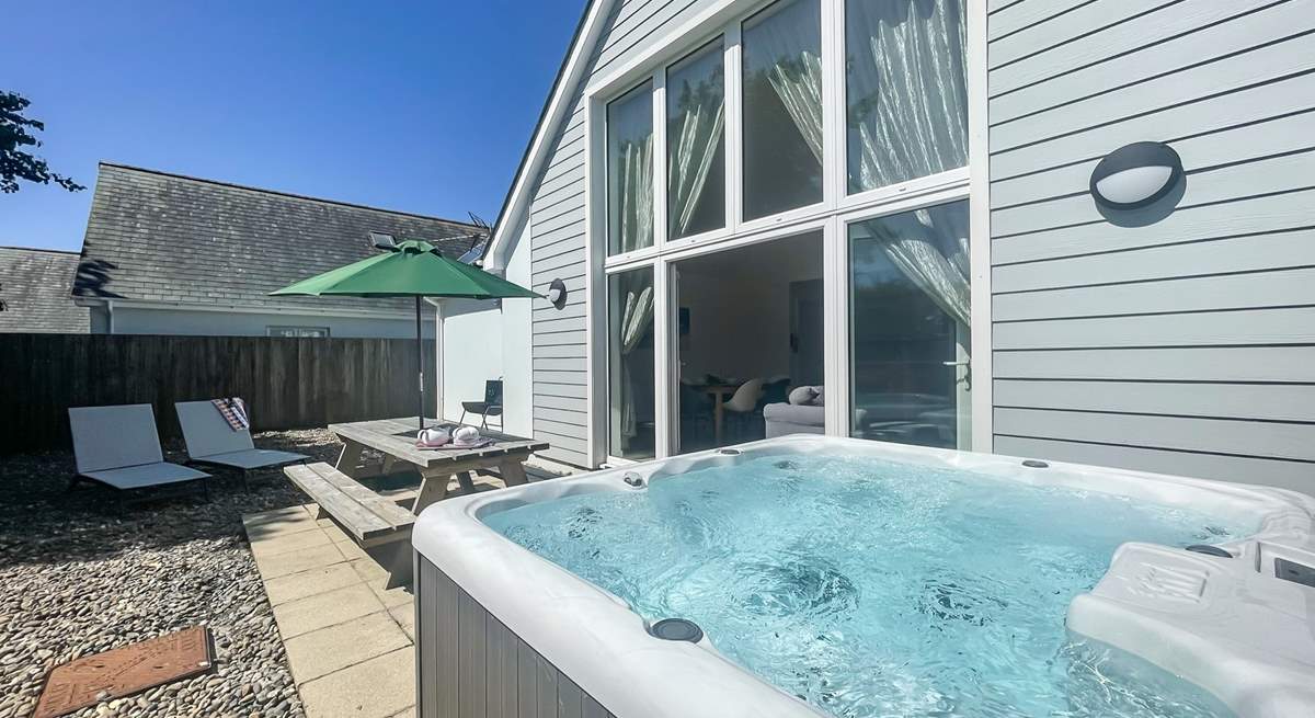 Sun-drenched days spent here. Please note there is an additional charge for the hot tub.