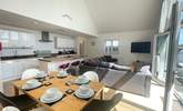The open plan living space invites you to relax and unwind. - Thumbnail Image