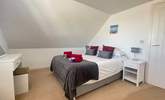Upstairs, you'll find the third bedroom with a king bed. - Thumbnail Image