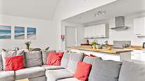 The cosy corner sofa offers the perfect spot to enjoy a family film night.