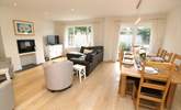 The delightful open plan living area has a sitting and dining area.  - Thumbnail Image