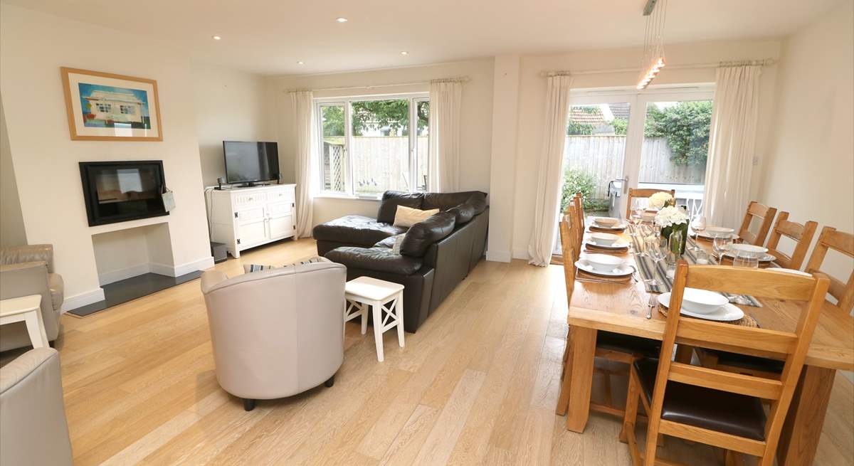 The delightful open plan living area has a sitting and dining area. 