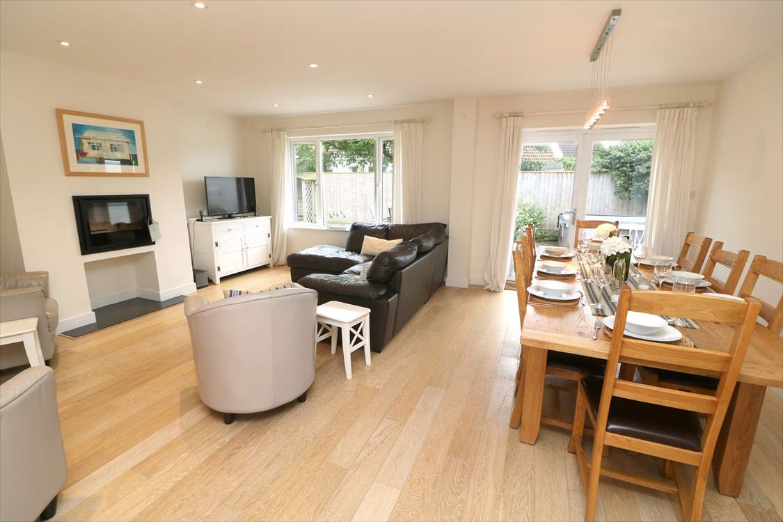 The delightful open plan living area has a sitting and dining area.