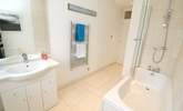 The family bathroom has a bath with fitted shower.  - Thumbnail Image