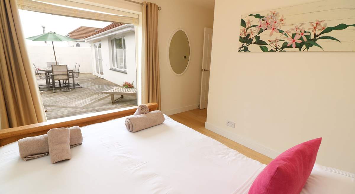 This gorgeous bedroom has access to the decked area.