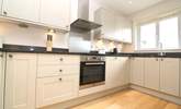 The kitchen has all the equipment you'll need and in addition there's a utility-room with washing machine, tumble-drier and freezer. - Thumbnail Image