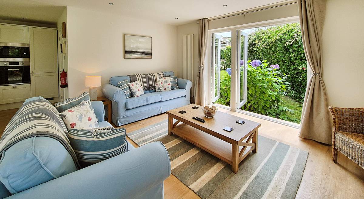 Welcome to Pebbles the Cosy interiors await in the open plan living area. 