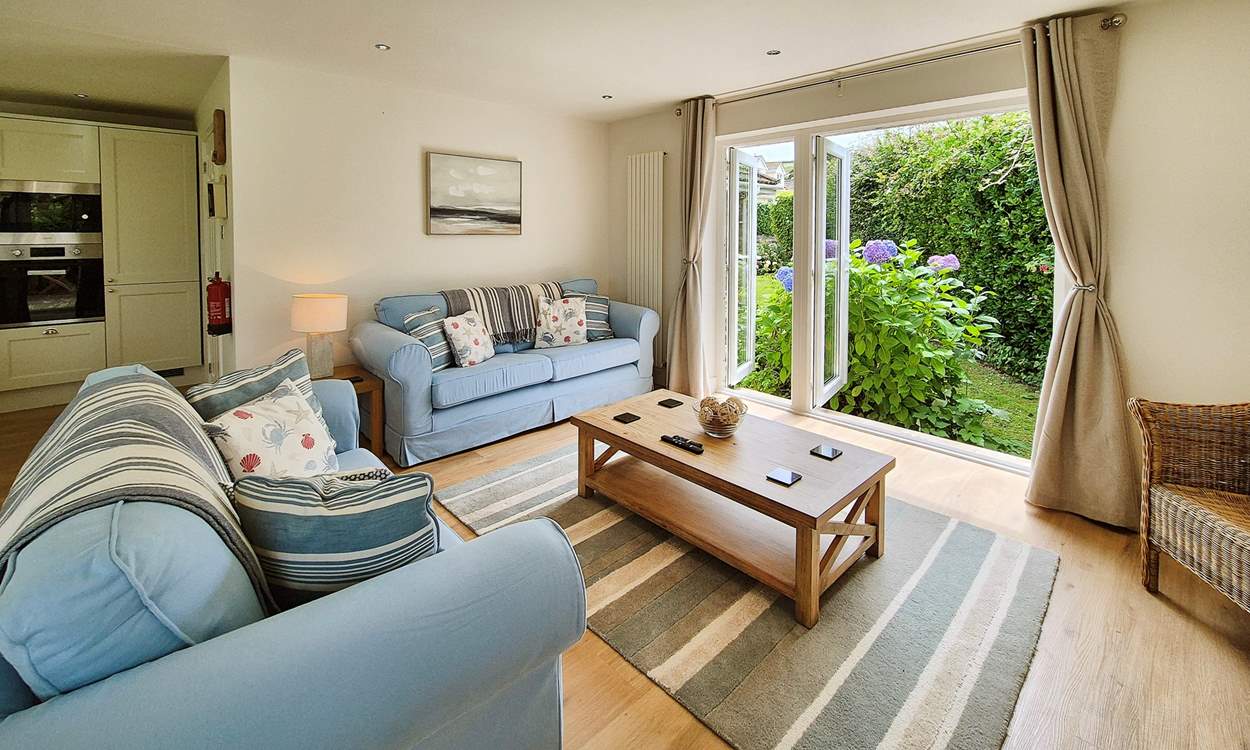 Cosy interiors await in the open plan living area.