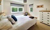 This bedroom has dual-aspect windows which look out into the garden.  - Thumbnail Image