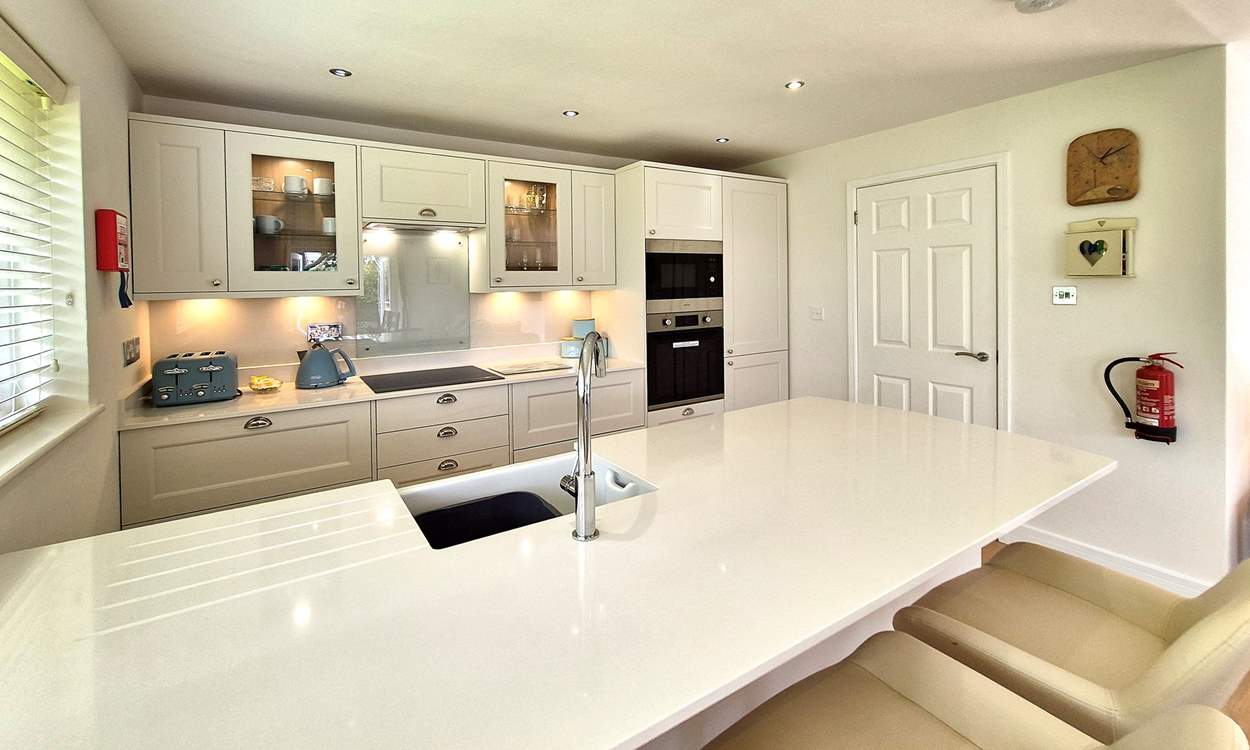 The stylish kitchen has all the equipment you will need to create a culinary masterpiece.