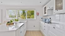 The stylish kitchen has all the equipment you will need to create a culinary masterpiece. 