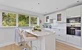 Sit at the breakfast-bar and chat with the chef.  - Thumbnail Image
