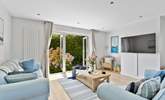 Sit on the comfy sofas and catch a movie on the Smart TV. - Thumbnail Image