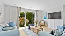Sit on the comfy sofas and catch a movie on the Smart TV.