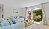 Welcome to Pebbles, coastal interiors await in the open plan living area.  - Thumbnail Image