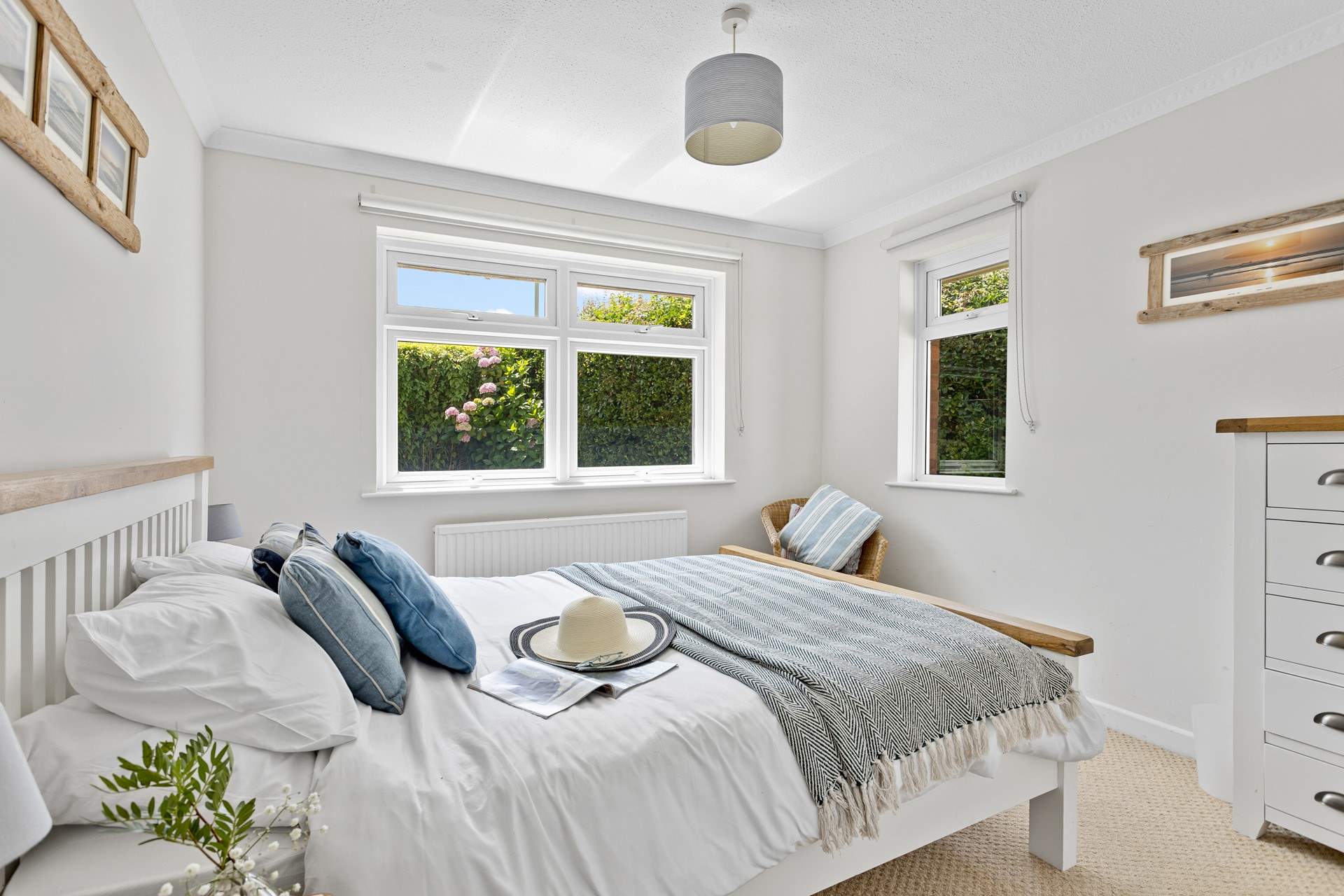 This bedroom has dual-aspect windows which look out into the garden. 