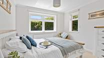This bedroom has dual-aspect windows which look out into the garden. 