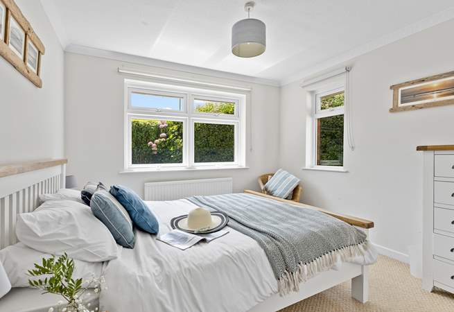 This bedroom has dual-aspect windows which look out into the garden. 